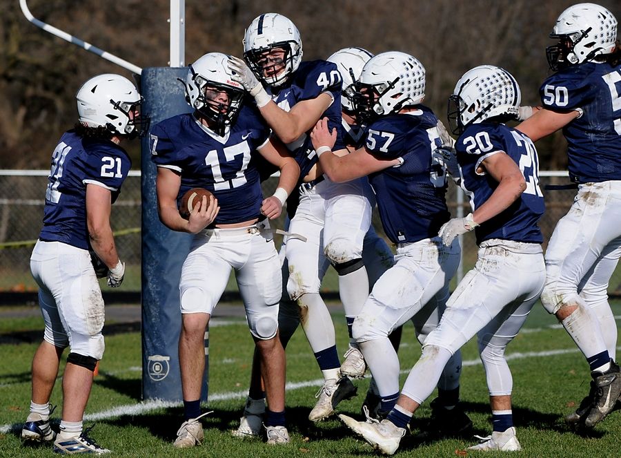 Cary-Grove's Jameson Sheehan celebrates a touchdown with his teammates during first quarter of the IHSA Class 6A semifinal football game against Lake Forest Saturday afternoon, Nov. 13, 2021, at Cary-Grove High School.