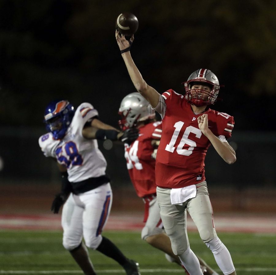 Palatine's Tommy Elter (16) throws the ball downfield Friday October 21, 2022 in Palatine.