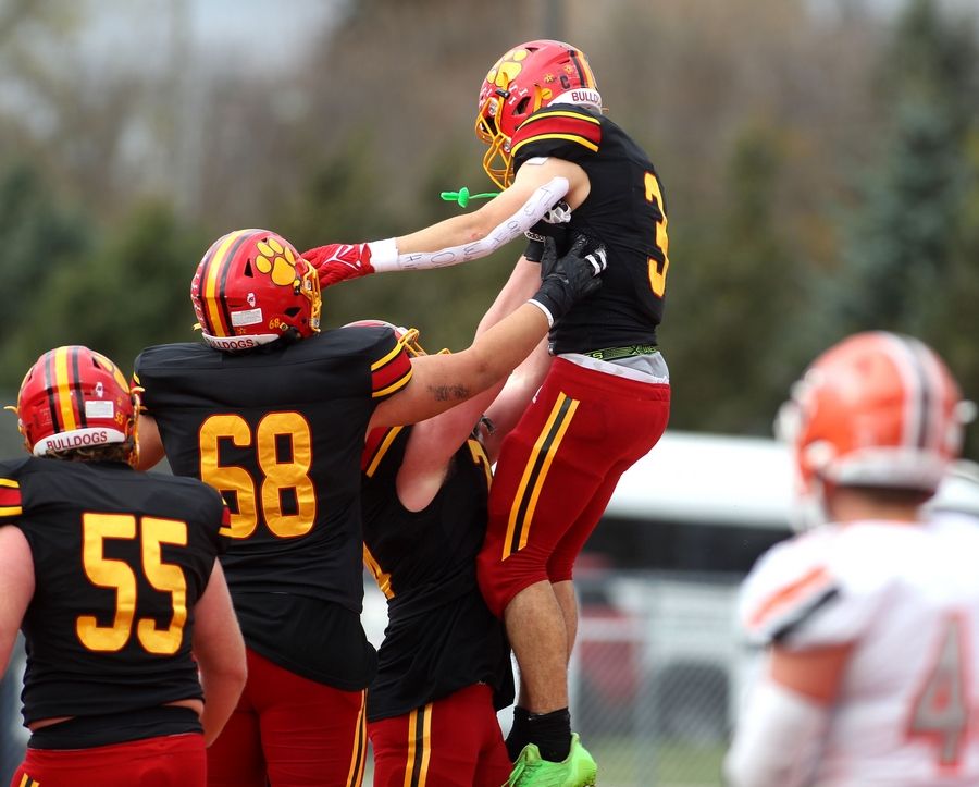Batavia's Ryan Whitwell celebrates his touchdown with teammates during their Class 7A second-round playoff game in Batavia against Hersey on Saturday, Nov. 5, 2022.