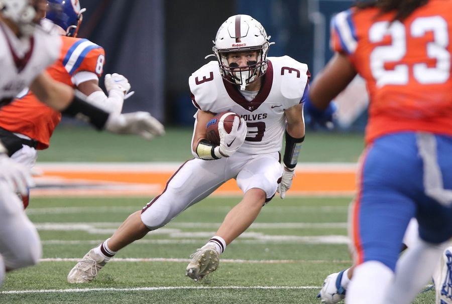 Prairie Ridge's Drake Tomasiewicz carries the ball during their IHSA Class 6A state championship game against East St. Louis Saturday, Nov. 26, 2022, in Memorial Stadium at the University of Illinois in Champaign.